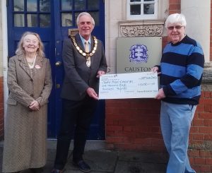 Tony Long present's Thame's Mayor with a donation