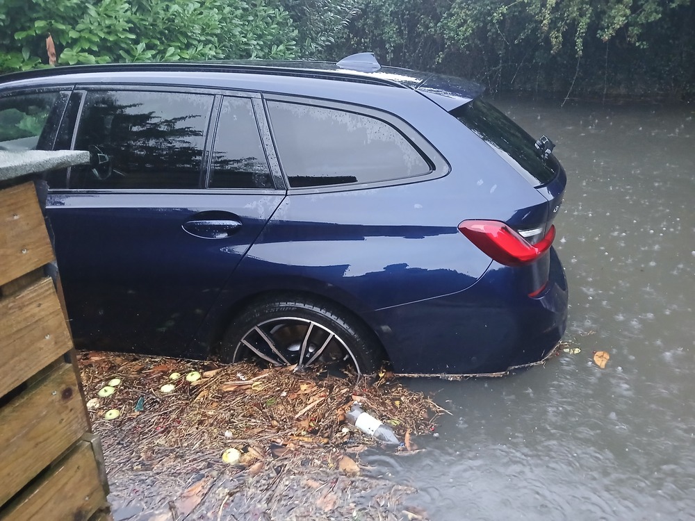 Car sitting in flood waters on Chinnor Road